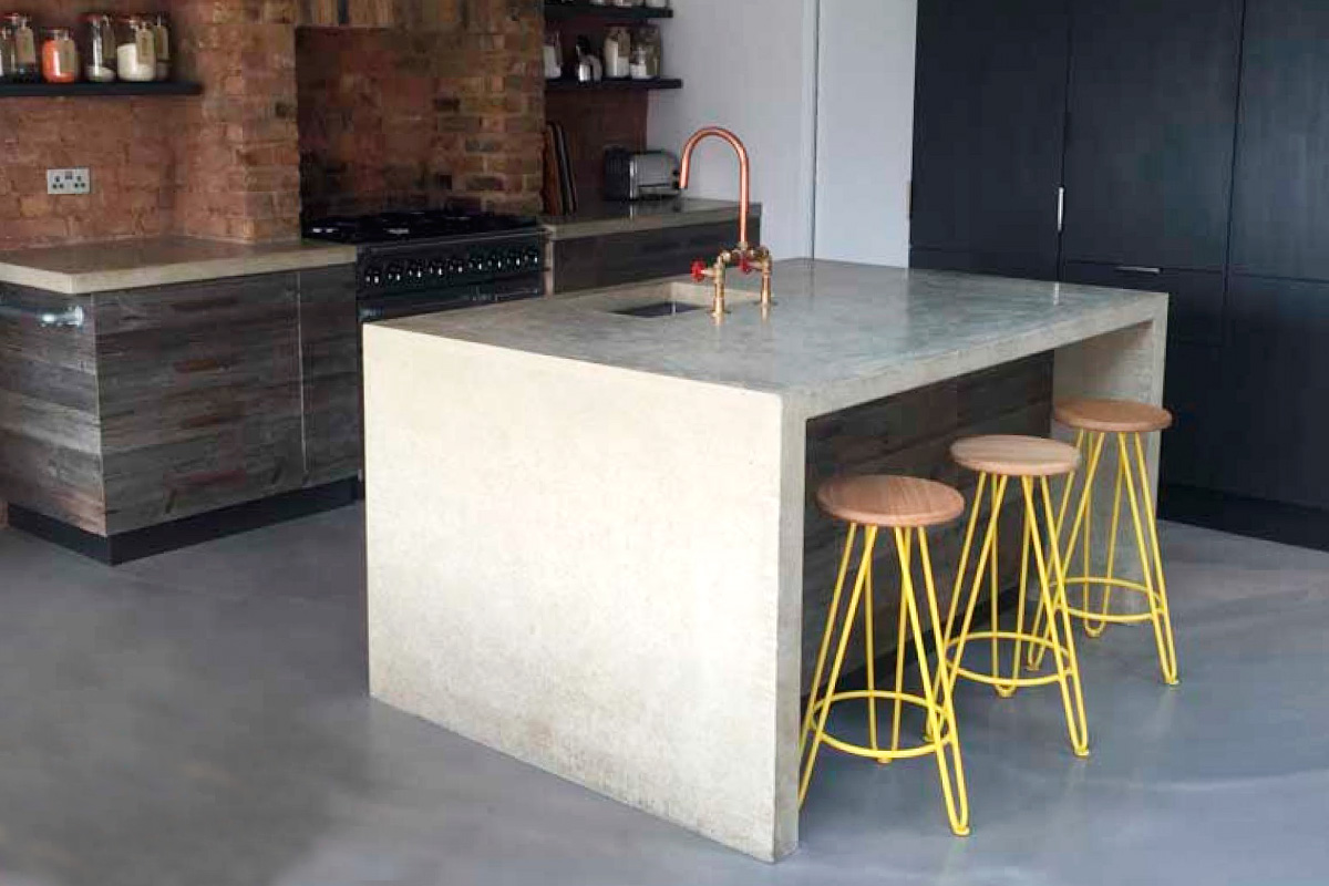 yellow hairpin leg bar stools in a contemporary kitchen in east london