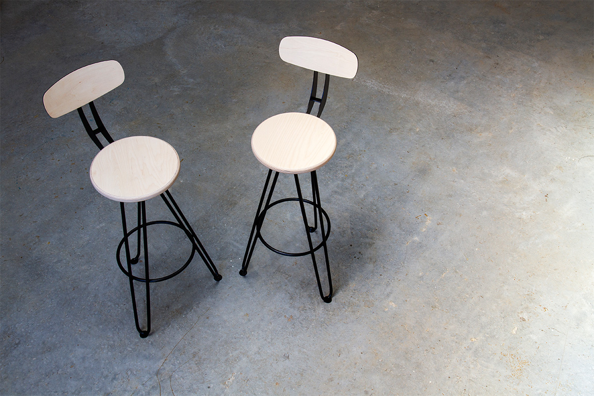 pair of hairpin leg bar chairs in black with birch ply seat and backrests