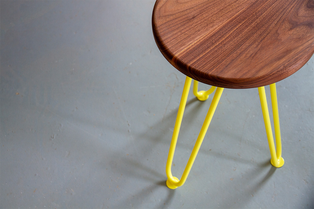 hairpin leg bar stool with yellow legs and walnut seat
