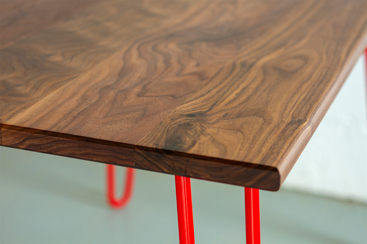 hairpin leg tabl with red legs and walnut table top